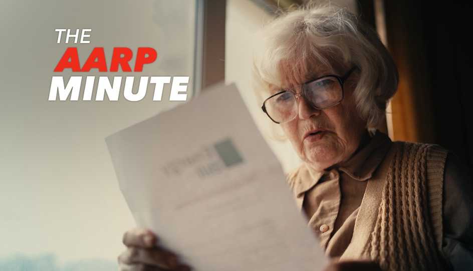 a woman is reading a sheet of paper