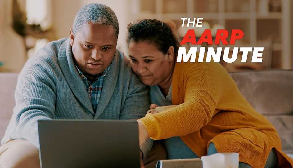 a man and woman looking at a computer screen