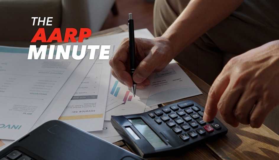 a person uses a calculator to fill out forms