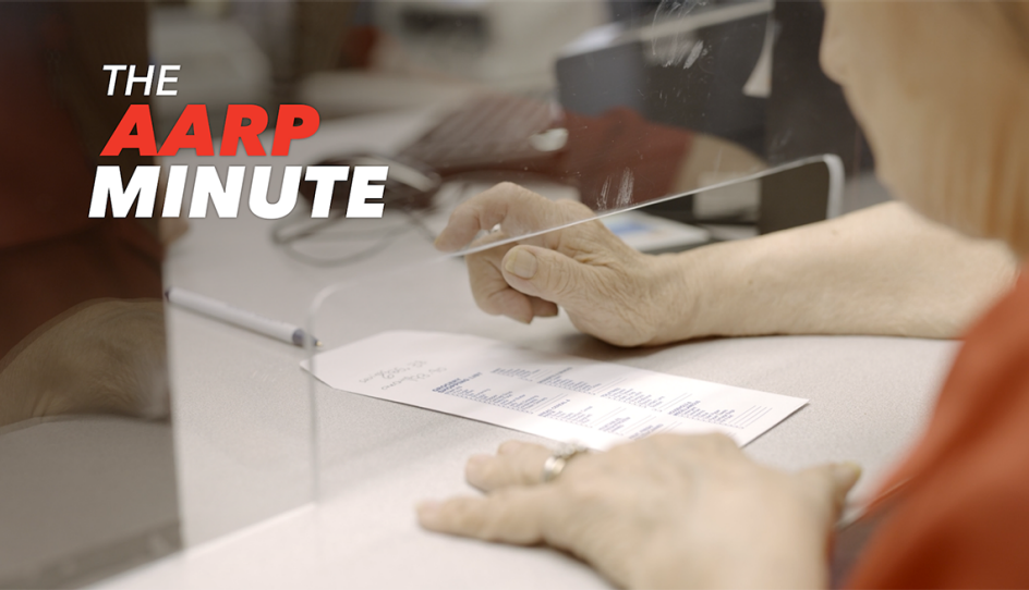 a person with paperwork at a counter