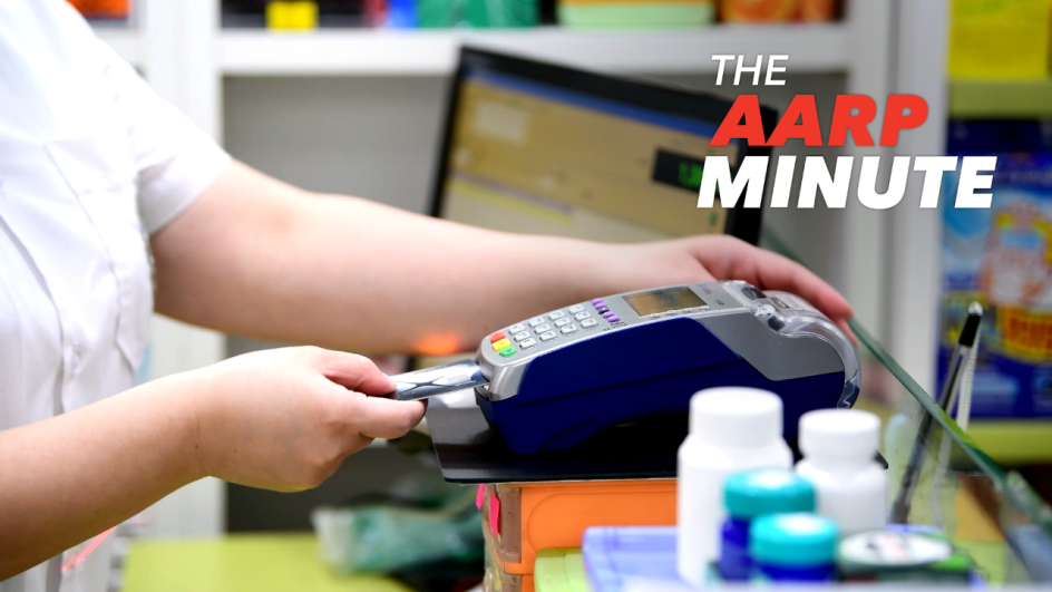 a woman putting. a credit card into a machine