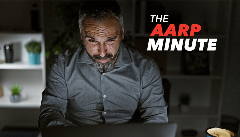 a man working on his laptop in the dark