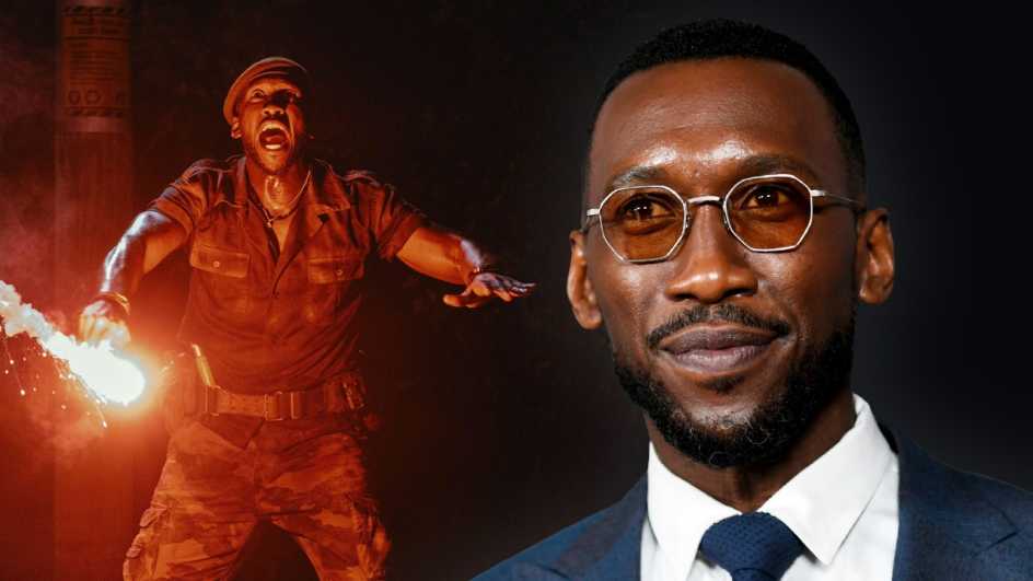 A man with glasses and a man holding a stick on fire