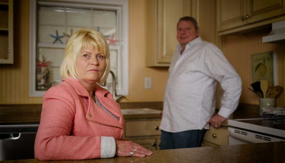 two people in a kitchen