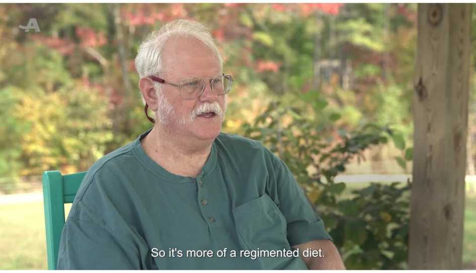 Man being interviewed about his experiences with travel accommodations