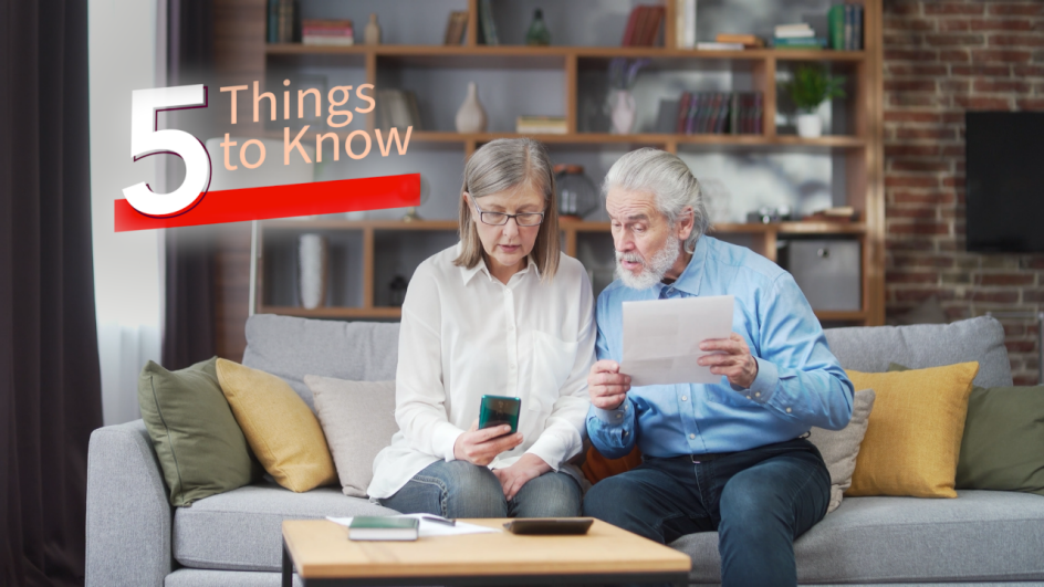 a man and woman sitting on a couch looking at paperwork. 5 things to know