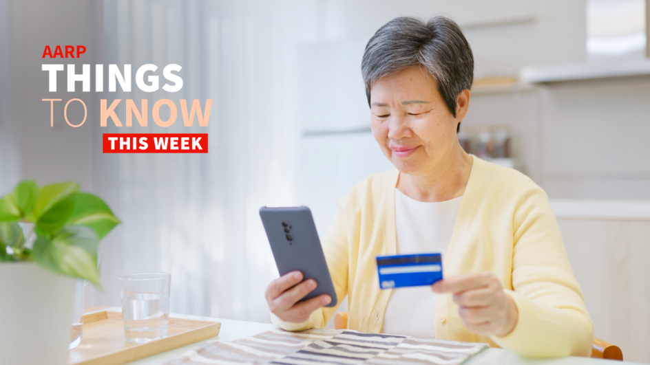 An older adult woman looks at her smartphone while holding a gift card