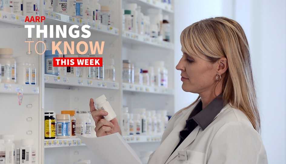 a person looking at pill bottles