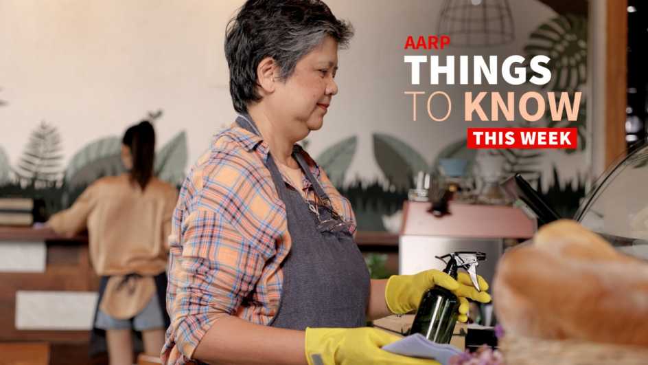 a photo shows an older adult woman cleaning an atrium in an office building