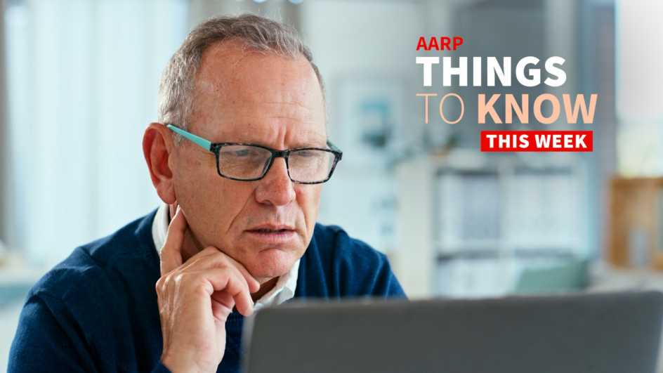 a photo shows an older adult male looking at a laptop