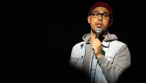 Comedian Jesus Trejo is a full-time caregiver, while building a promising comedy career in stand-up. Jesus Trejo on stage during care to laugh, an a a r p studios documentary