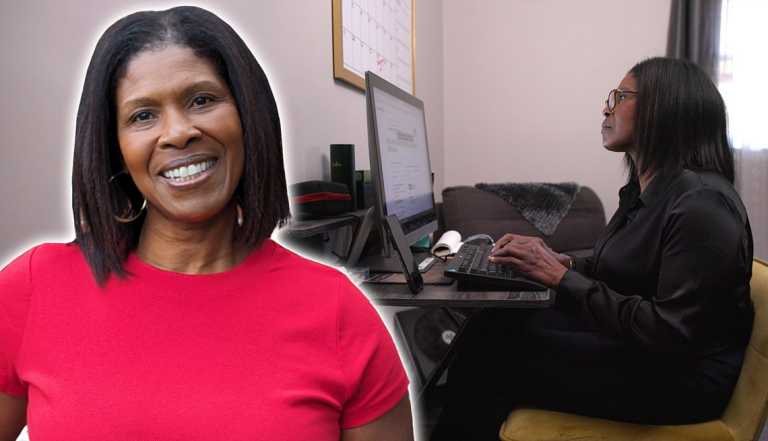 a woman is working at her computer