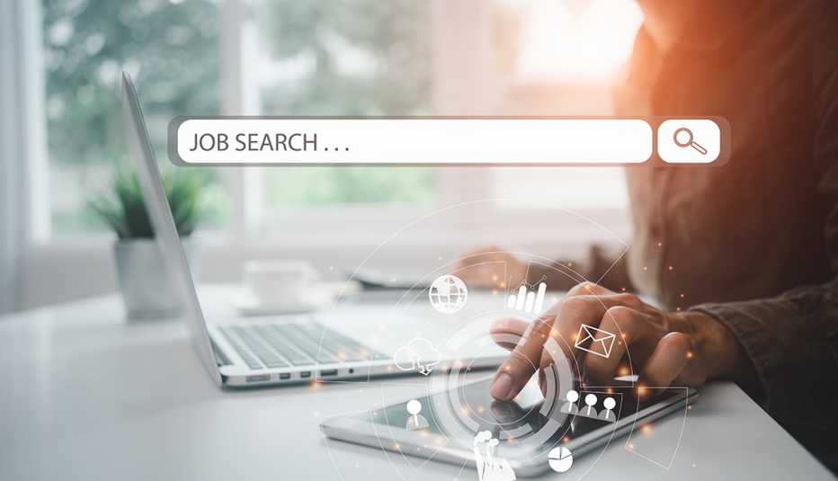 a search bar in front of a man who's looking at a laptop