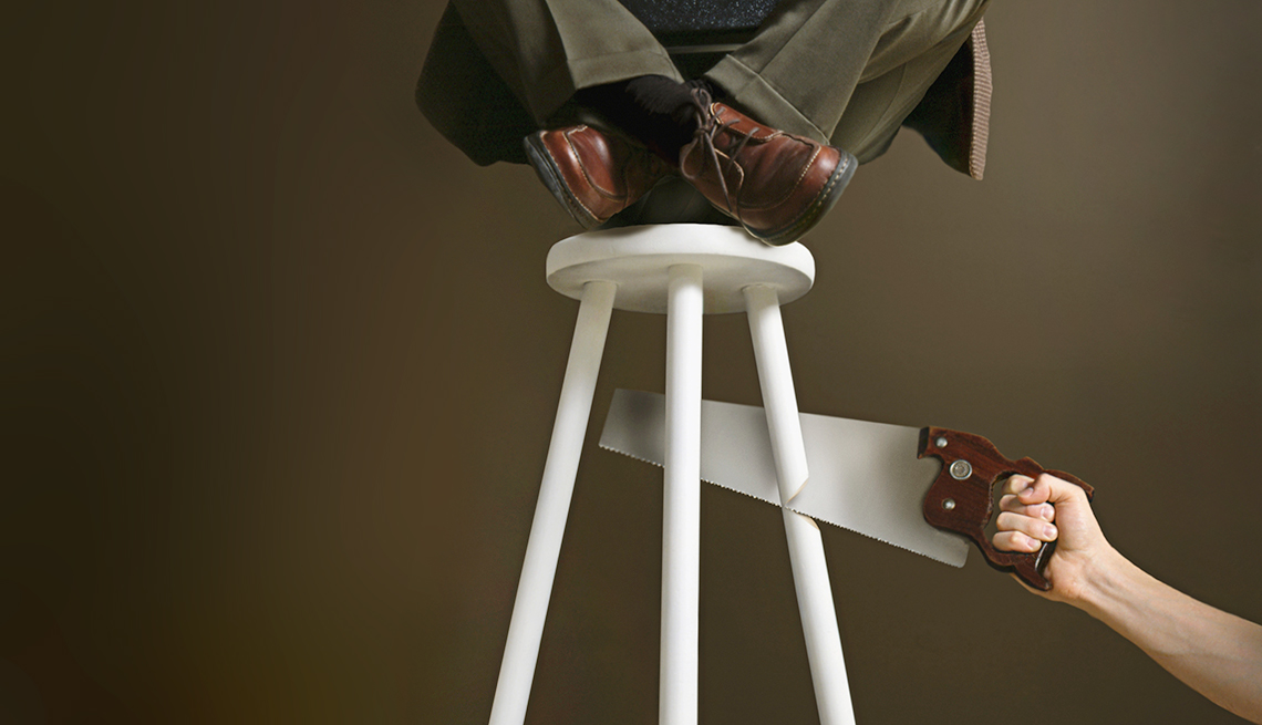 stool being cut from under older male worker represents ageism