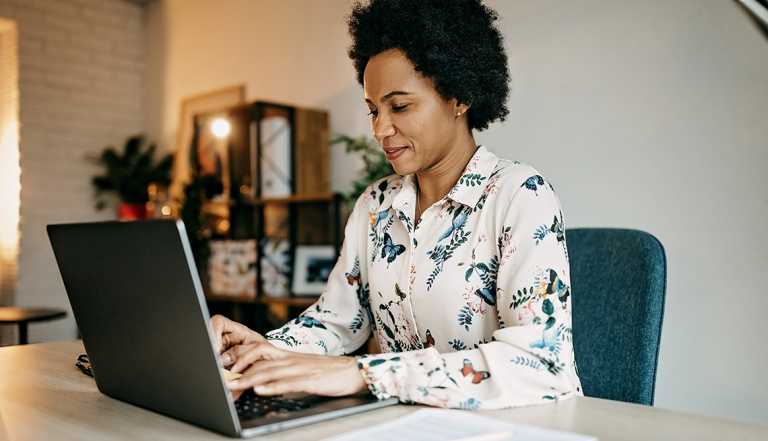 Woman working from home with laptop