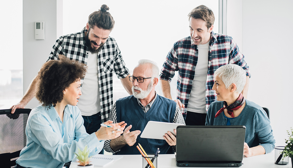 multi-generational group of employees in an office