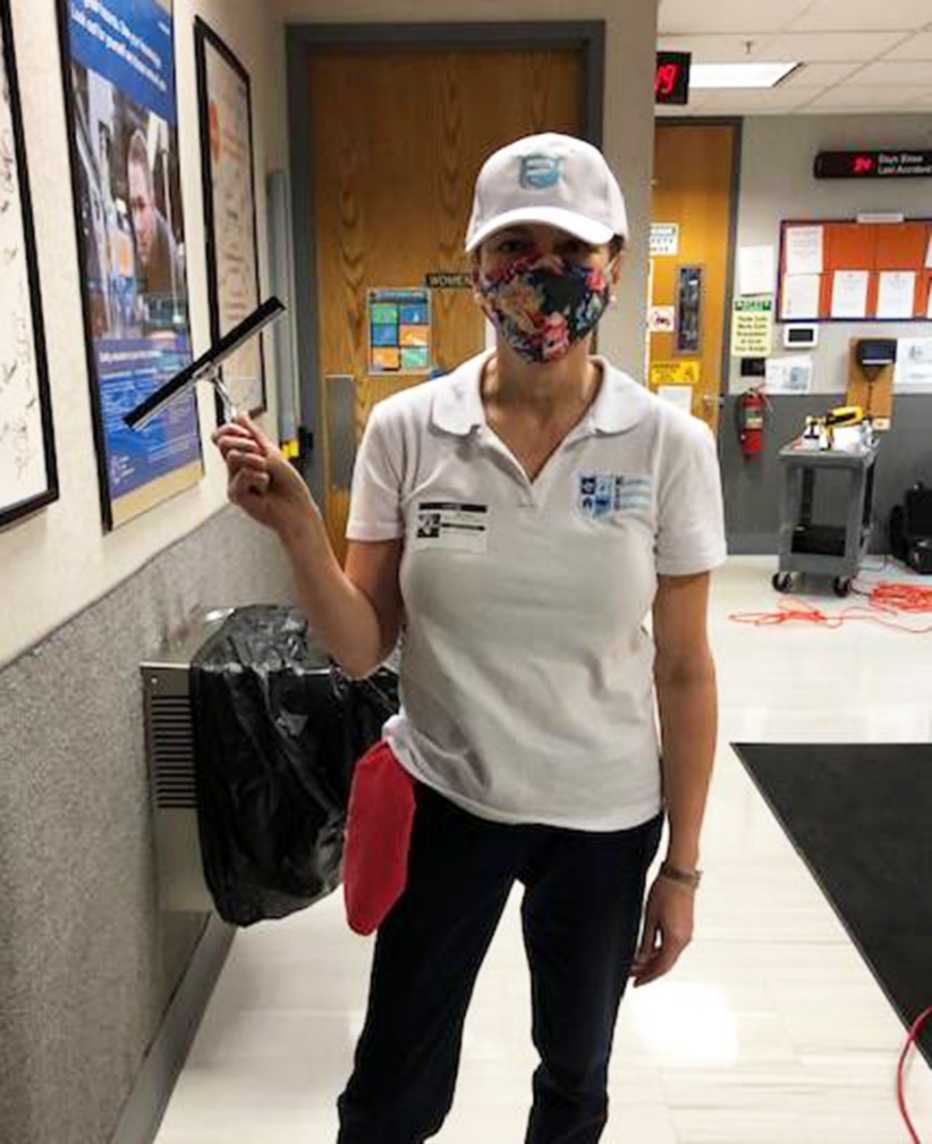 elaine brauch holds a squeegee at work