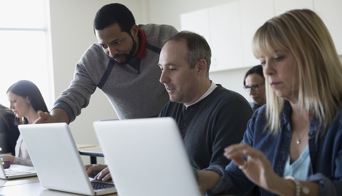 Adults attending a computer class