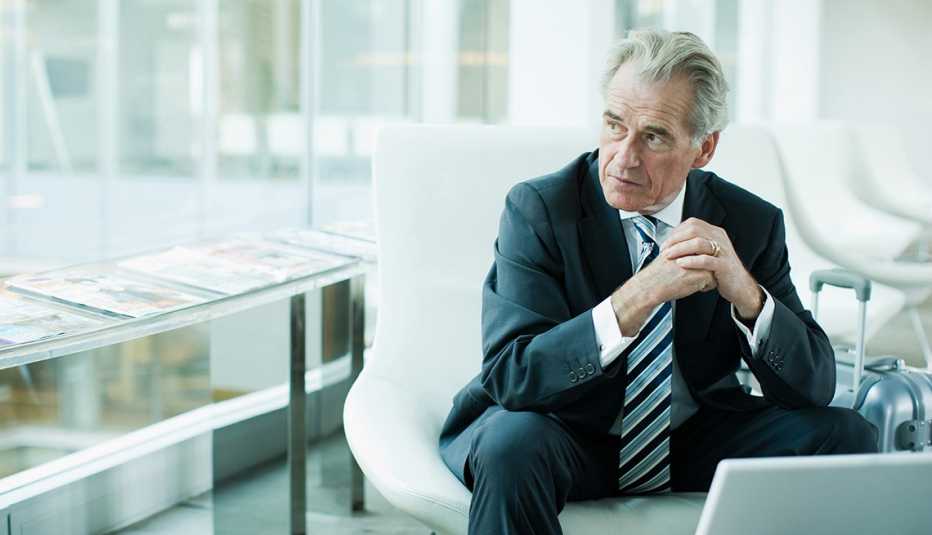 a businessman sitting at a laptop
