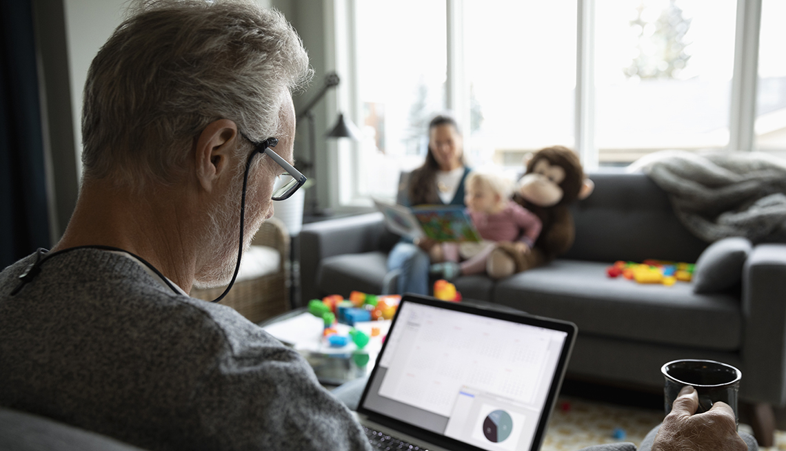 Man looking at his computer working from home