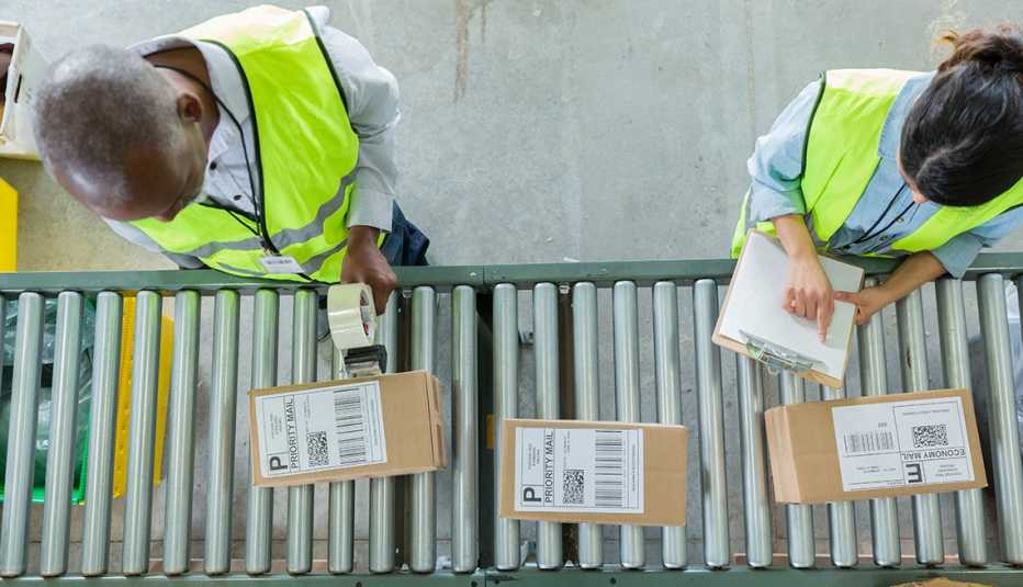 High angle view of people working in distribution warehouse 