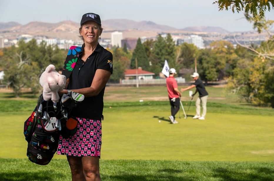barbara morrow stands on a golf course