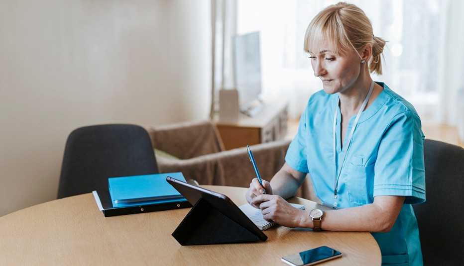 A nurse is on a call with a patient at her home