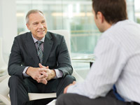 Two businessmen talking together