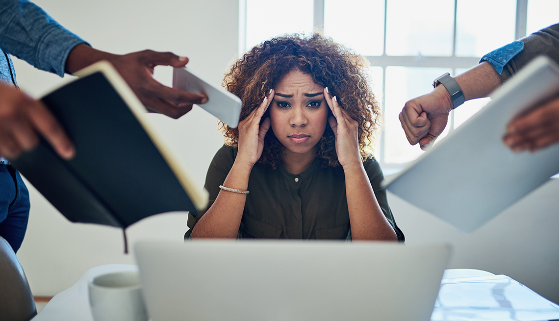 A woman is stressed out at work
