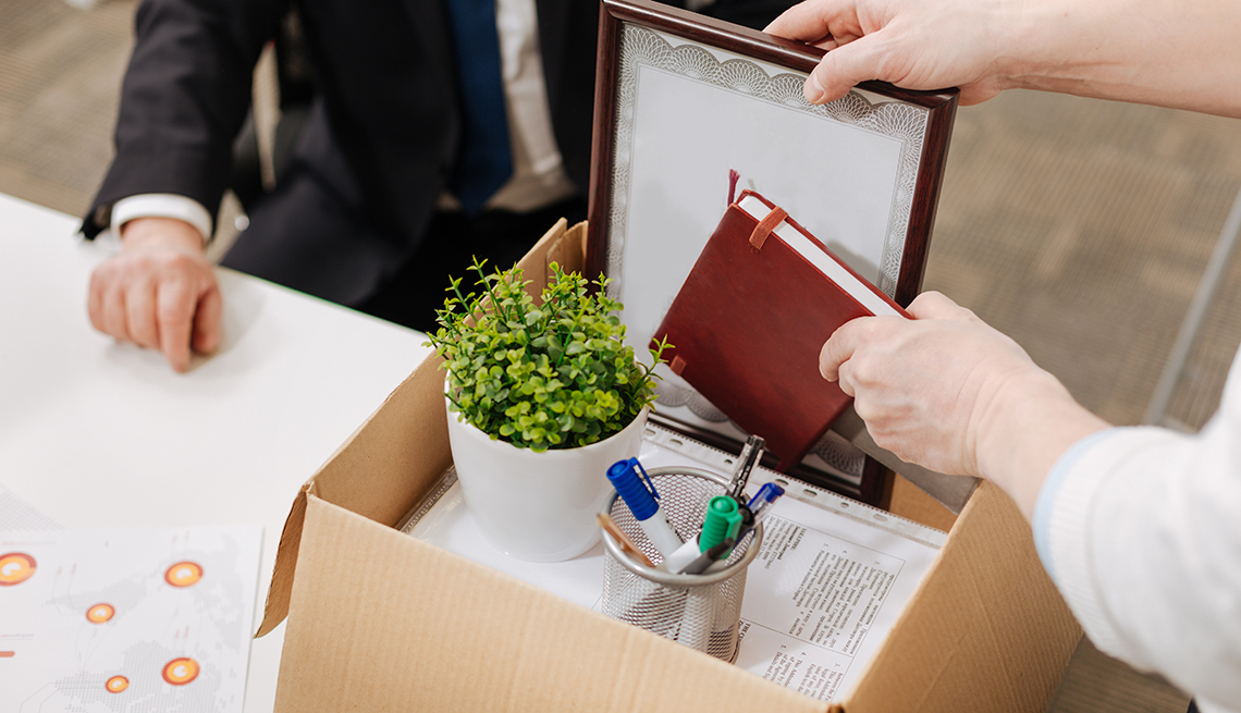 person putting objects into box