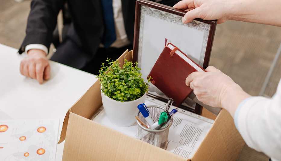 person putting objects into box