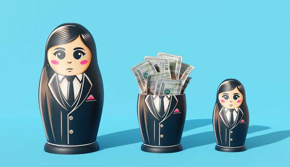 three nesting dolls in a row the middle one has its top off and there are several twenty dollar bills inside
