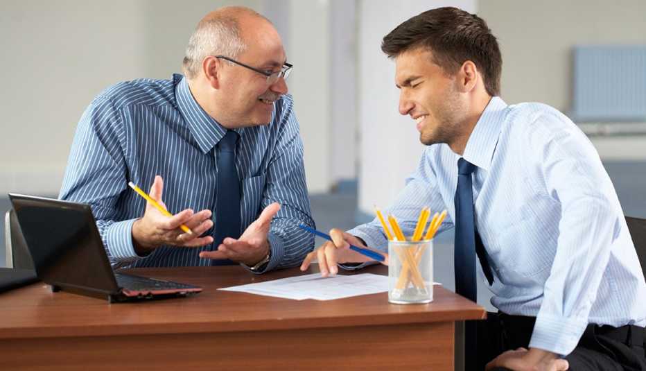 Two Business Men Working, Laptop, Office, AARP Work, Job Hunting, Tips For Working For A Younger Boss