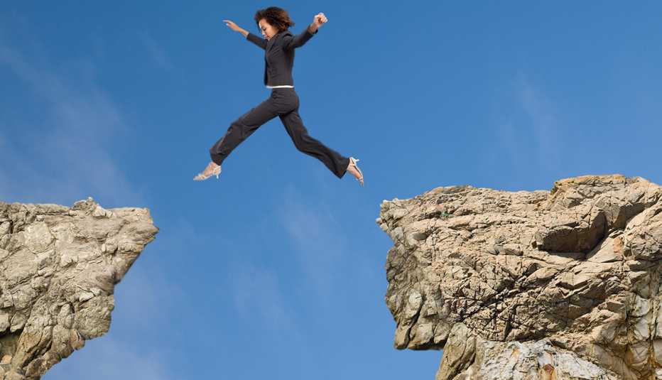 woman leaping over a valley woman leaping over a valley