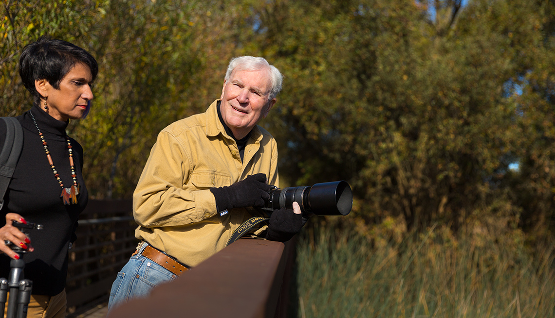Nature Photographer Richard Turner (with wife Prem Hunji) taking a photo in a field
