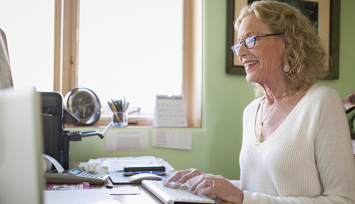 A woman is working from home in her home office