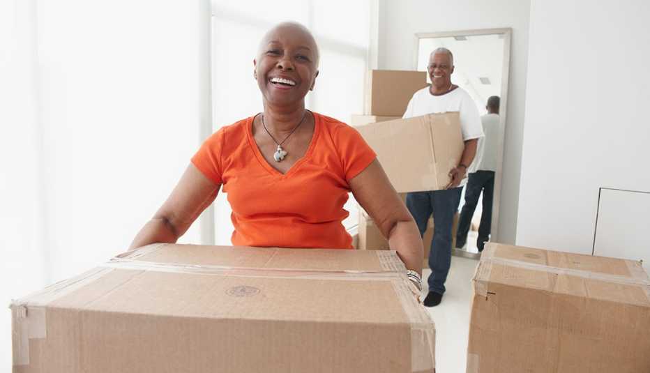Couple carrying boxes in new home, JBQ: Relocation Decision 