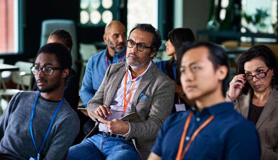 A group of people sitting in a conference