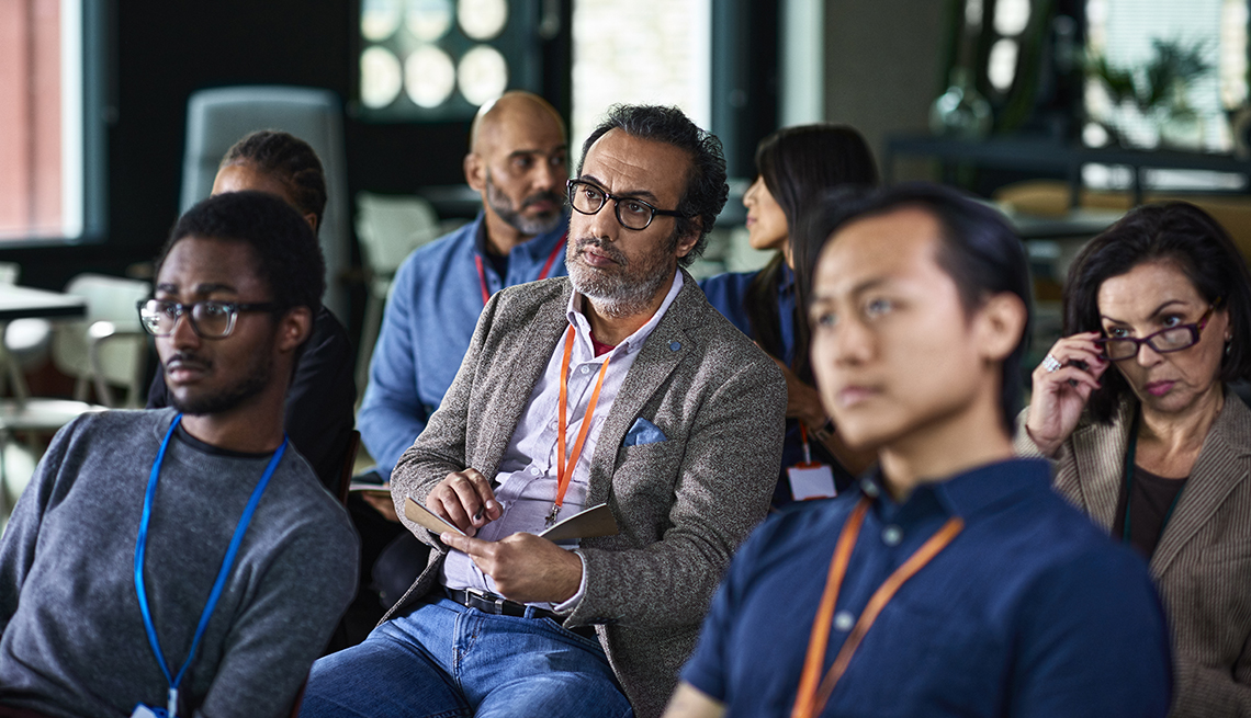 A group of people sitting in a conference