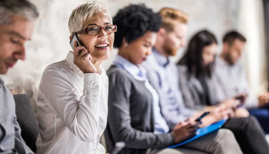 Woman waiting in line talking on the phone