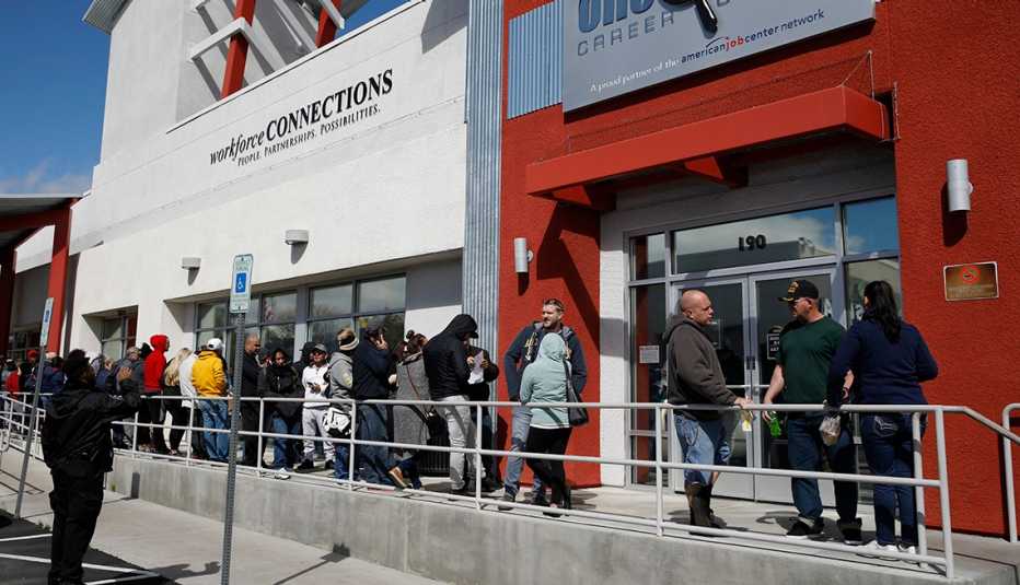 People waiting in line to enter a building