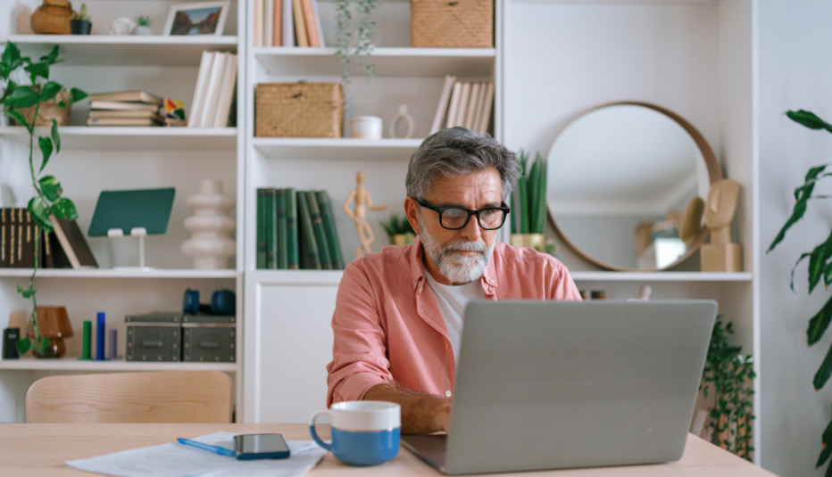 man in front of bookshelf