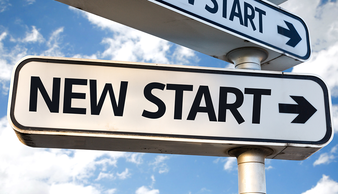 A sign that says new start with an arrow pointing