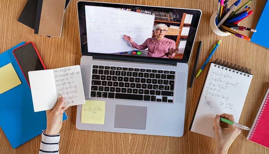 A woman is teaching a student online