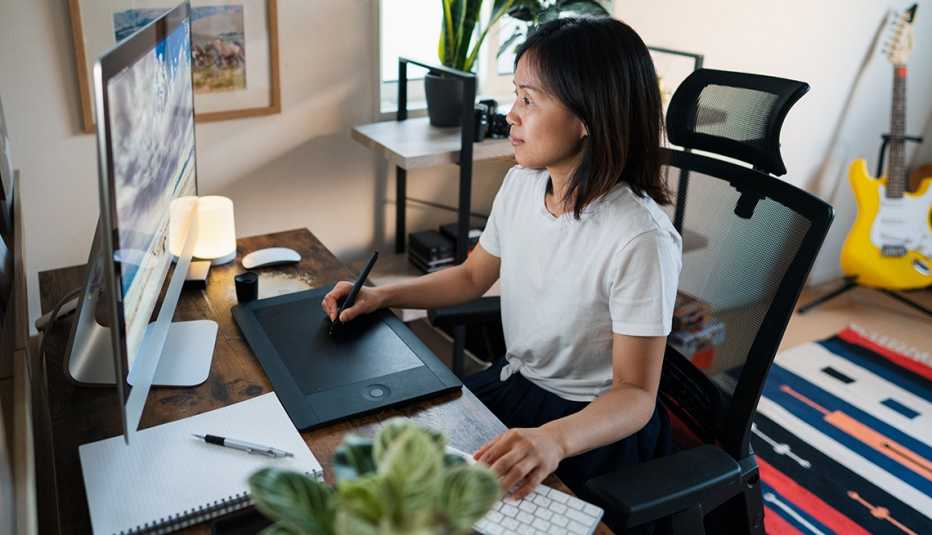 A woman works at her desk A woman works at her desk
