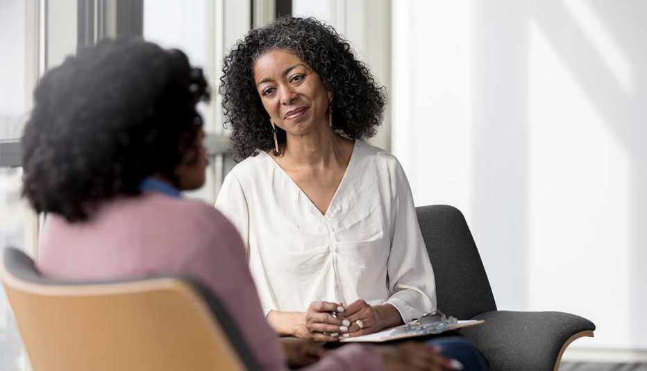 Two women talking in an office