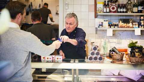 small business owner with customer small business owner with customer