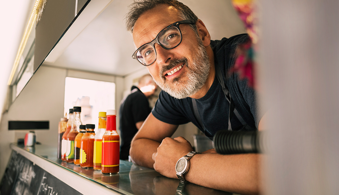 smiling owner of a food truck 