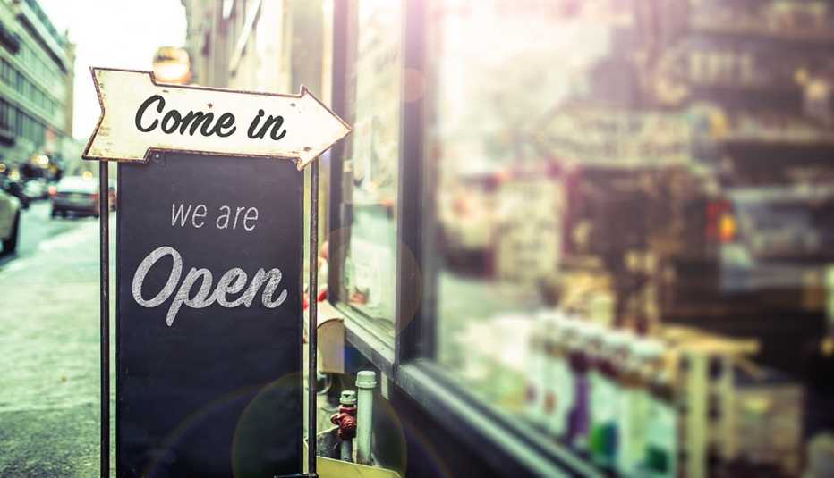 A sign that says come in we are open