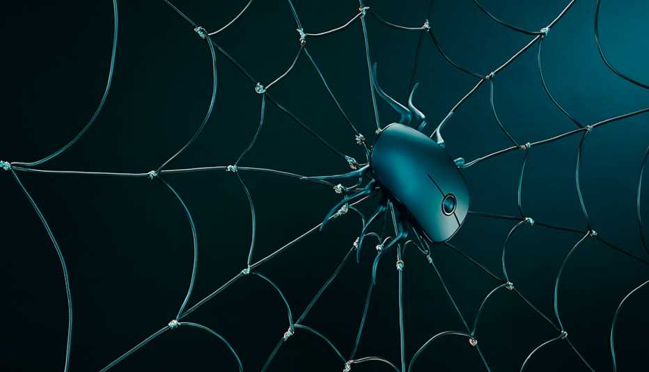 Un ratón de computador encima de una telaraña en un fondo negro degradado a verde